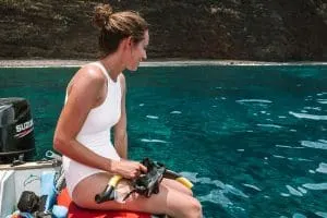 Girl on Zodiac Boat Snorkel Tour along Na Pali Coast in Kauai