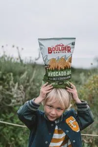 Child holding Boulder Canyon Potato Chips