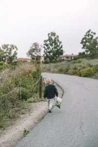 Child walking along coastal trails in Crystal Cove State Park, California
