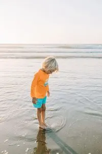 Child playing in the ocean at Pacifica Beach