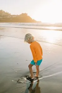 Child playing in the ocean at Pacifica Beach