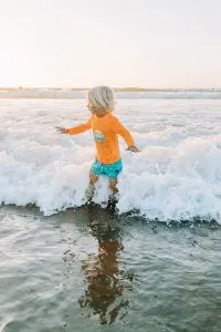 Child playing in the ocean at Pacifica Beach