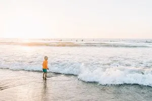 Child playing in the ocean at Pacifica Beach