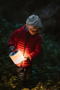 Carrying the Luci Light, a solar powered lantern for camping