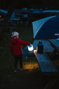 Carrying the Luci Light, a solar powered lantern for camping
