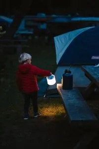 Carrying the Luci Light, a solar powered lantern for camping