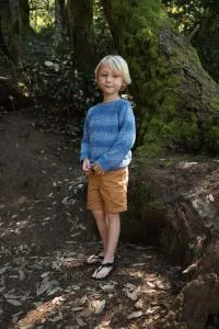 Child hiking in lightweight, flexible barefoot sandals for kids