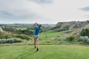 Golfer at Bully Pulpit Golf Course in Medora, North Dakota