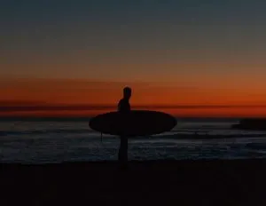 Surfer at Sunset in California