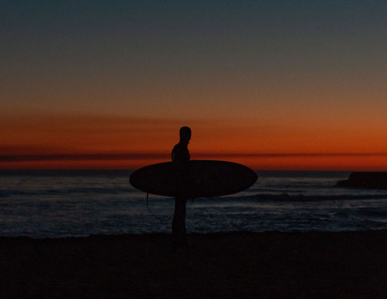 Surfer at Sunset in California