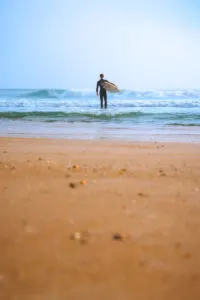 Surfer at Anastasia State Park near St Augustine Florida